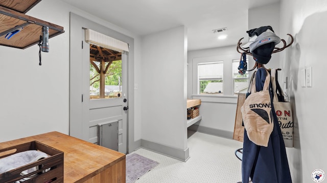 mudroom featuring baseboards, visible vents, a wealth of natural light, and recessed lighting