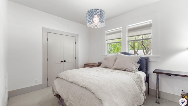 carpeted bedroom with a closet