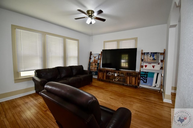 living room featuring hardwood / wood-style flooring and ceiling fan