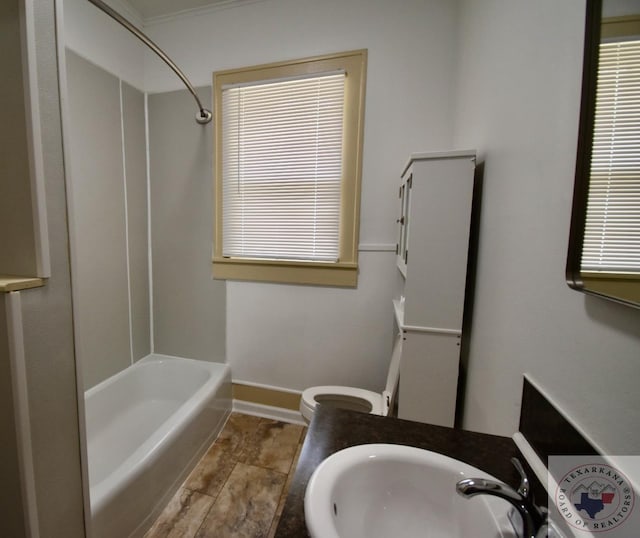 full bathroom with vanity, toilet, ornamental molding, and shower / tub combination