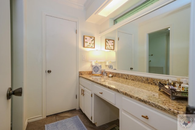 bathroom featuring crown molding, tile patterned flooring, and vanity