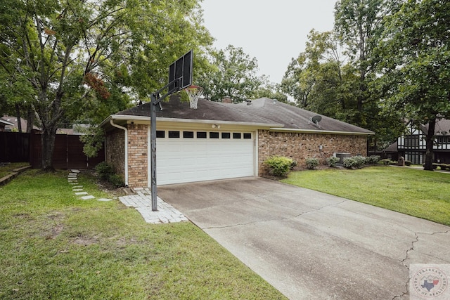 view of side of property featuring a garage and a yard