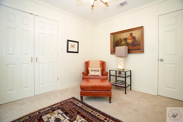 sitting room featuring crown molding and light colored carpet