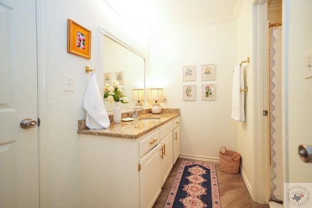 bathroom featuring tile patterned floors, vanity, and ornamental molding