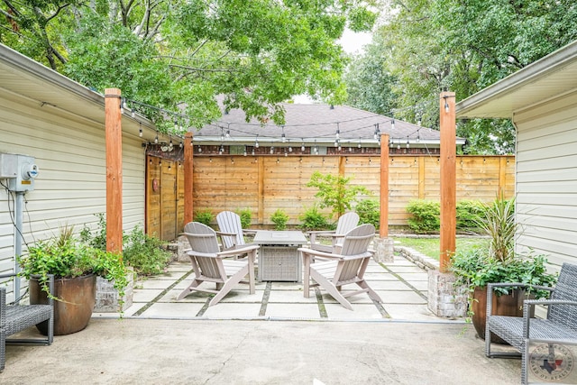 view of patio / terrace with an outdoor fire pit