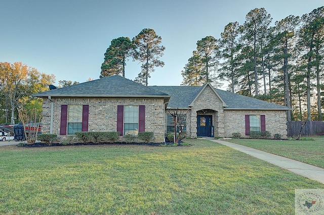 french country style house with a front lawn