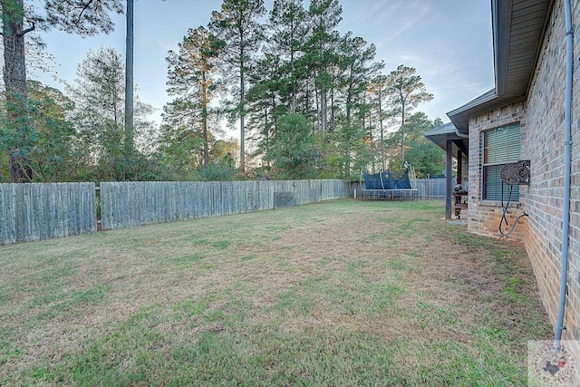 view of yard featuring a trampoline