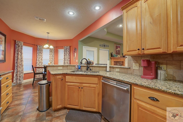 kitchen with dishwasher, hanging light fixtures, sink, backsplash, and light stone counters