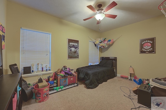 carpeted bedroom with ceiling fan