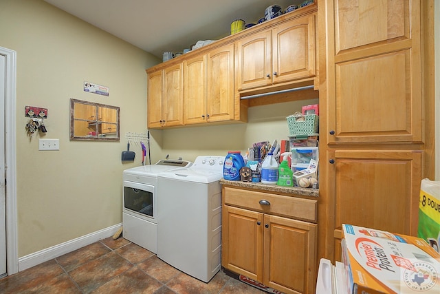 laundry area featuring cabinets and separate washer and dryer