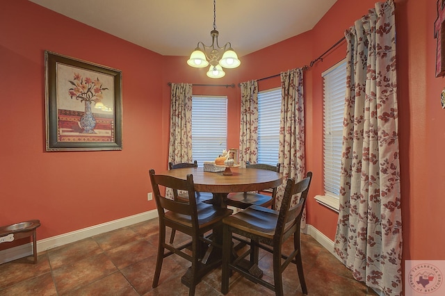 dining room with a chandelier