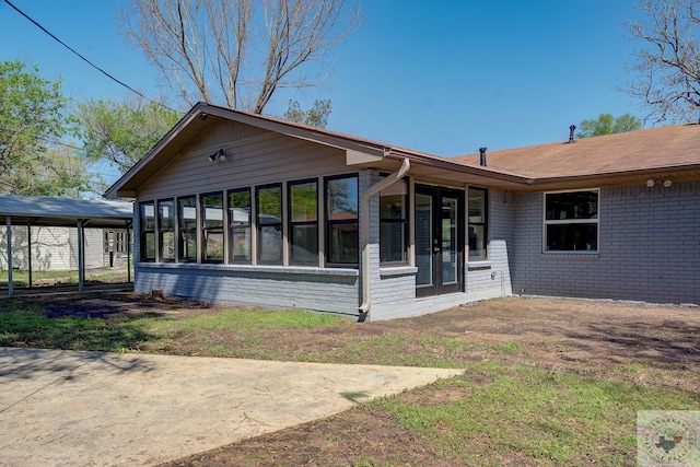 rear view of house with a sunroom