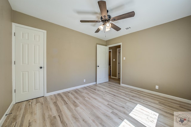 unfurnished bedroom featuring ceiling fan and light hardwood / wood-style flooring