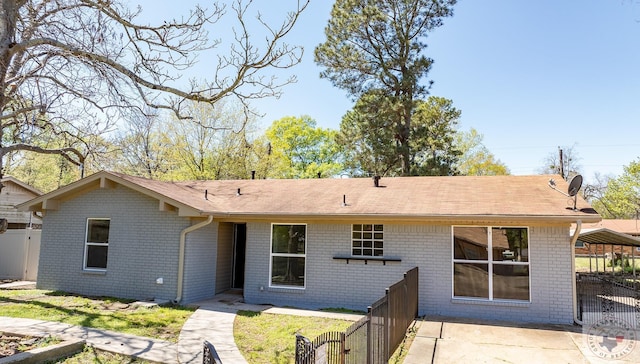 back of house featuring a patio area and a yard