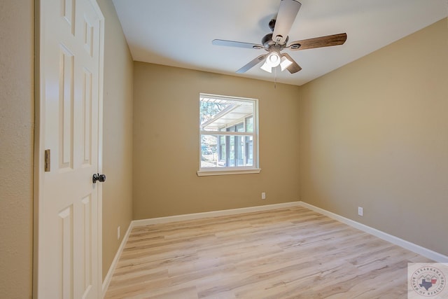 spare room with ceiling fan and light wood-type flooring