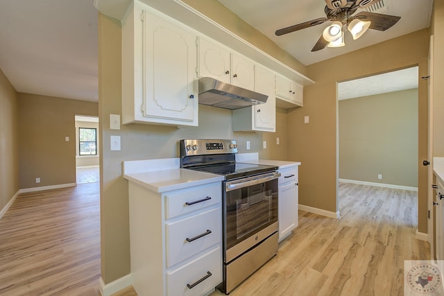 kitchen with ceiling fan, white cabinetry, light hardwood / wood-style flooring, and stainless steel electric range