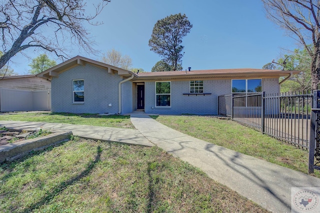 ranch-style house featuring a front lawn