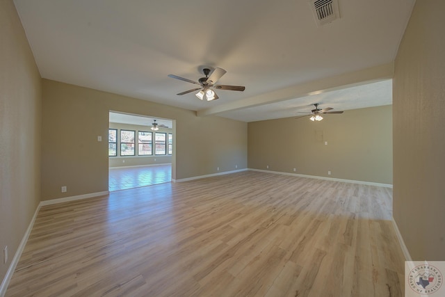 spare room featuring ceiling fan and light wood-type flooring