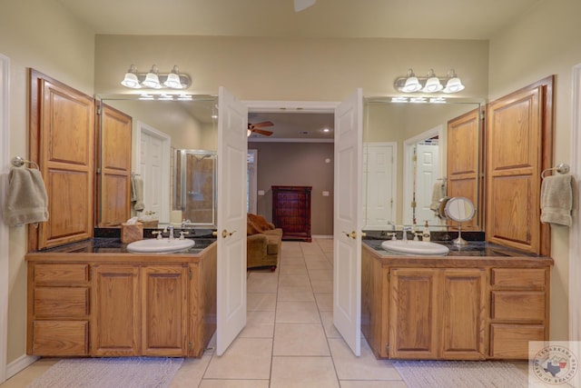 bathroom with vanity, ceiling fan, walk in shower, and tile patterned flooring