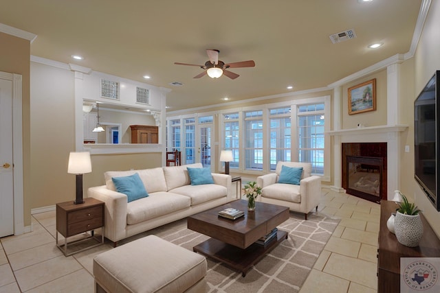 living room featuring ceiling fan, crown molding, and light tile patterned floors