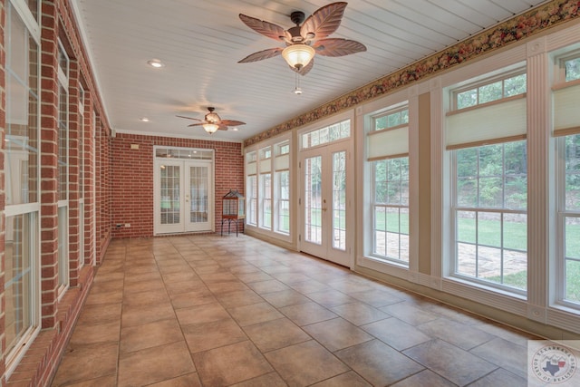 unfurnished sunroom featuring french doors