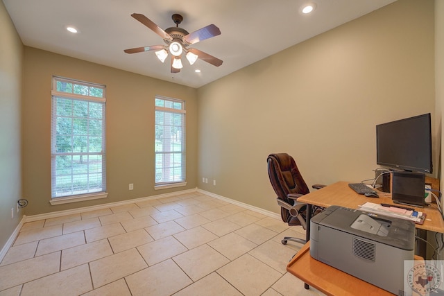 unfurnished office with light tile patterned floors and ceiling fan