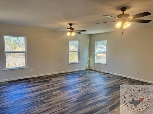 spare room featuring dark wood-type flooring