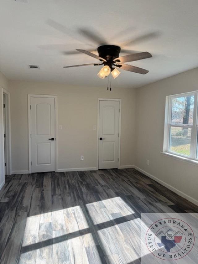 unfurnished room featuring dark hardwood / wood-style floors