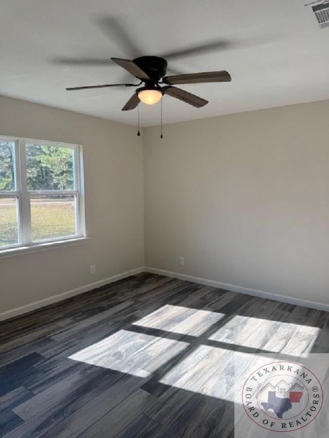 unfurnished room featuring dark hardwood / wood-style flooring