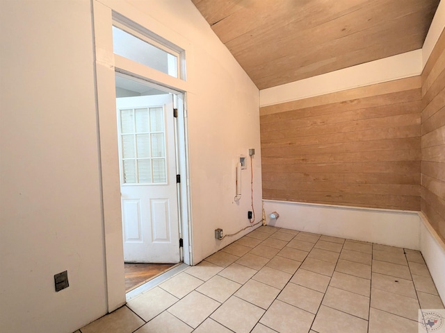 washroom with wooden ceiling and light tile patterned flooring