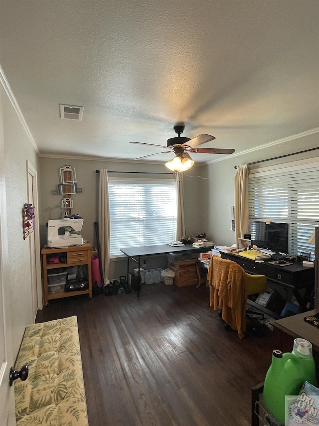 office area featuring ceiling fan, a textured ceiling, dark hardwood / wood-style flooring, and ornamental molding