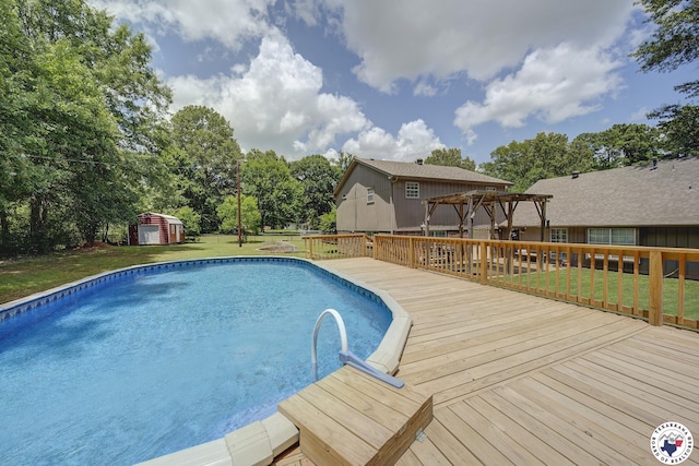 13 Timberlane St, Texarkana, TX 75501 - swimming pool featuring a pergola, a wooden deck, a lawn, a shed, and view of scattered trees