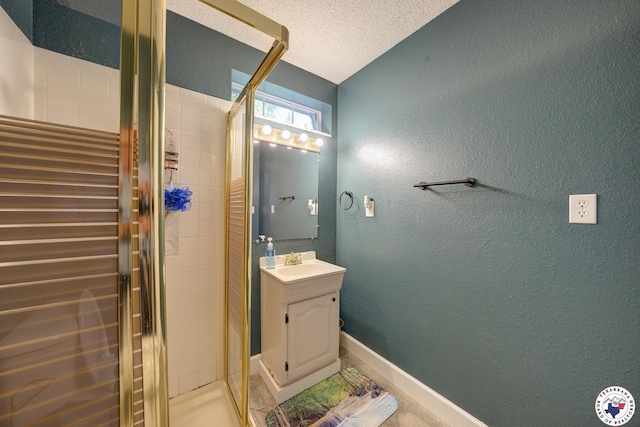 13 Timberlane St, Texarkana, TX 75501 - bathroom featuring a textured wall, a shower stall, vanity, and a textured ceiling