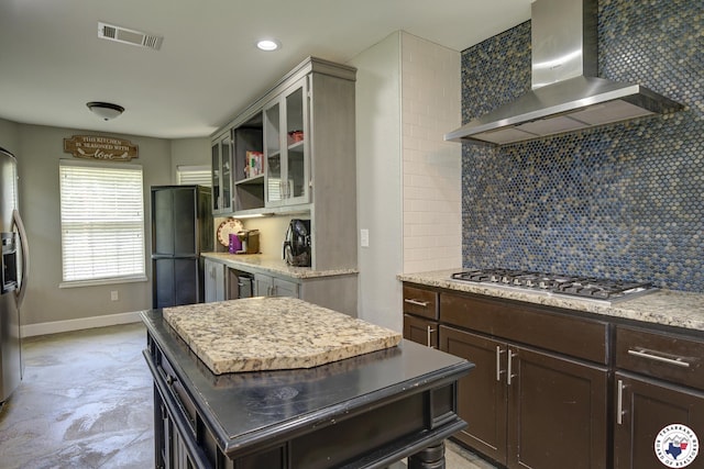 13 Timberlane St, Texarkana, TX 75501 - kitchen with wall chimney range hood, appliances with stainless steel finishes, decorative backsplash, dark brown cabinetry, and open shelves