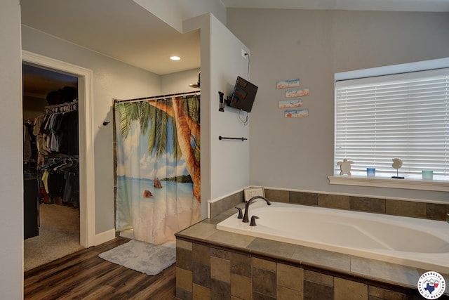 13 Timberlane St, Texarkana, TX 75501 - full bath featuring a bath, wood finished floors, curtained shower, and a spacious closet