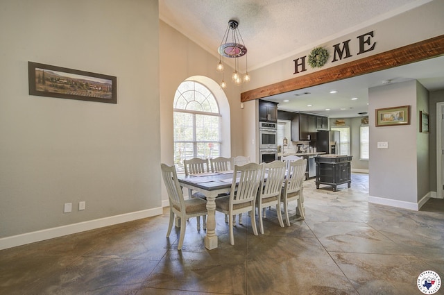 13 Timberlane St, Texarkana, TX 75501 - dining room featuring a textured ceiling and high vaulted ceiling