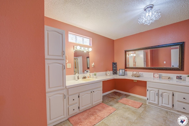 13 Timberlane St, Texarkana, TX 75501 - bathroom with vanity and a textured ceiling