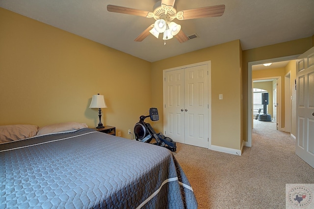 bedroom with carpet, a closet, and ceiling fan