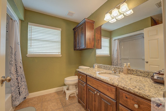 full bathroom with vanity, toilet, tile patterned floors, and shower / bath combo with shower curtain