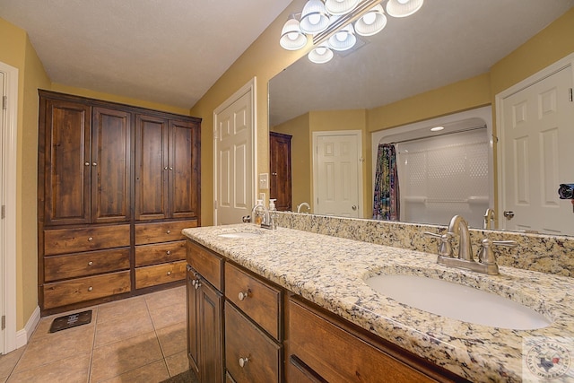 bathroom featuring tile patterned floors and vanity