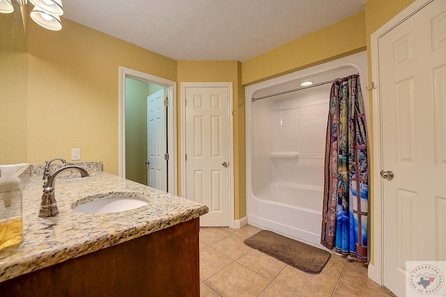 bathroom featuring tile patterned floors, vanity, and shower / bathtub combination with curtain