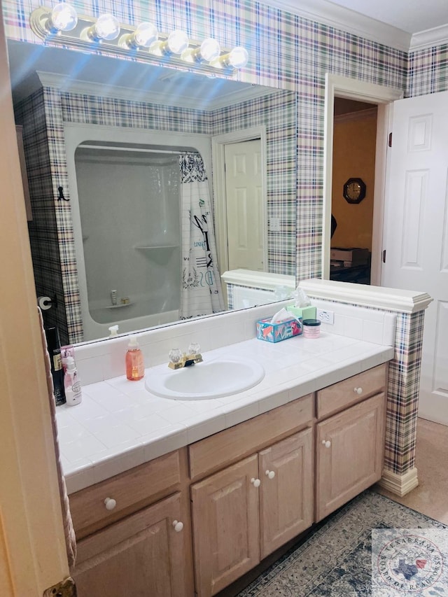 bathroom with vanity, ornamental molding, and shower / bathtub combination with curtain