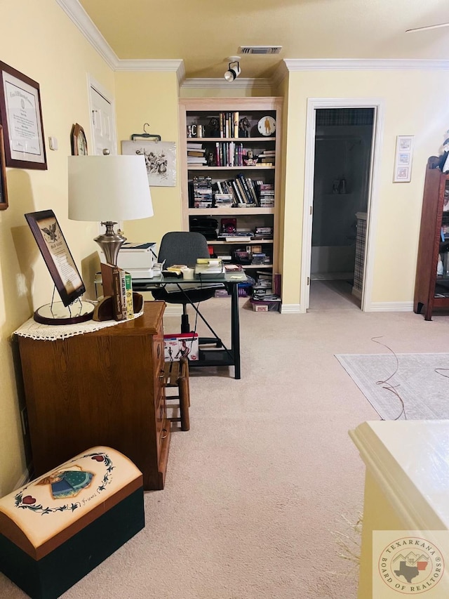 home office with crown molding and carpet floors