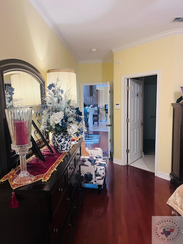 corridor with hardwood / wood-style flooring and ornamental molding