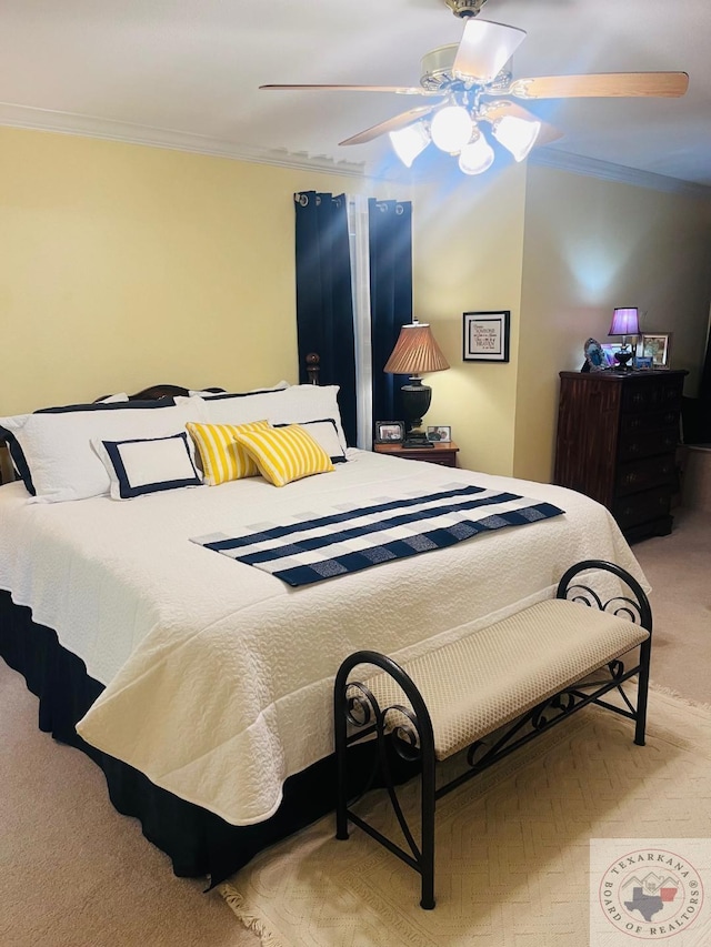 bedroom featuring ceiling fan and ornamental molding