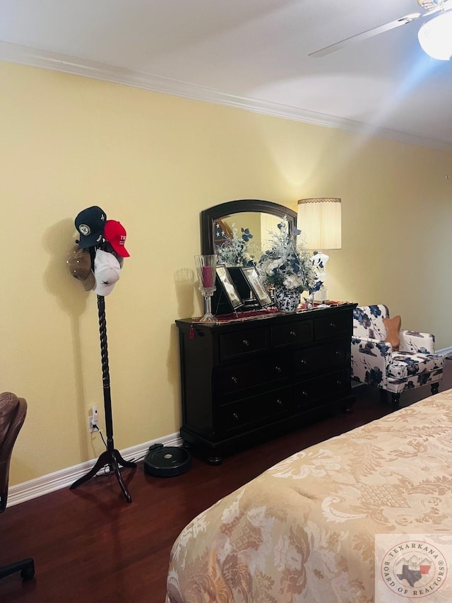 bedroom with ceiling fan, dark hardwood / wood-style floors, and crown molding