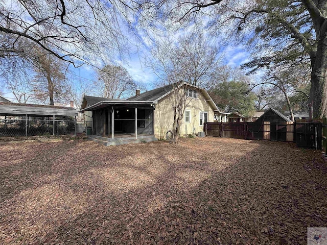 rear view of house featuring cooling unit