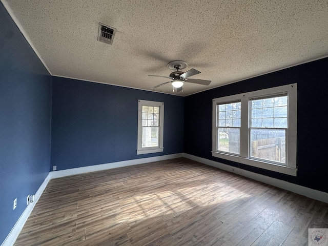 unfurnished room featuring wood-type flooring, a textured ceiling, and ceiling fan