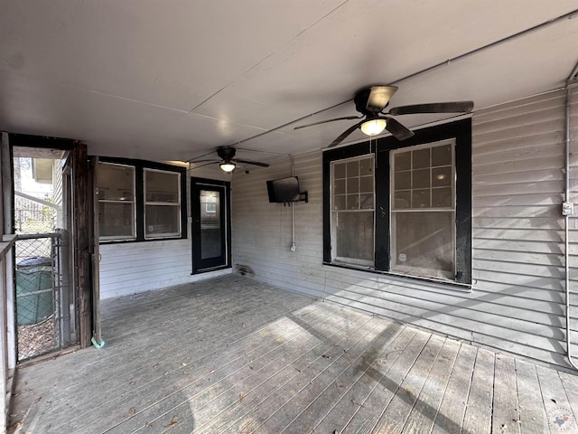 wooden terrace featuring ceiling fan