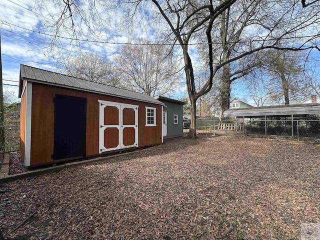 view of outbuilding featuring a carport